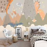 Kids bedroom featuring mountain dinosaur wall mural with space elements, showing playful styling ideas