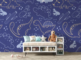 Boys bedroom featuring gold and navy dinosaur wall mural
