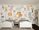 Kids bedroom featuring cute dinosaur mural wallpaper with reading nook and playmat