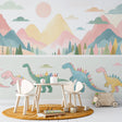 Dinosaur wallpaper with pastel mountains creating a sweet atmosphere in a modern nursery with white furniture