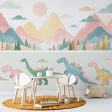 Dinosaur wallpaper with pastel mountains creating a sweet atmosphere in a modern nursery with white furniture