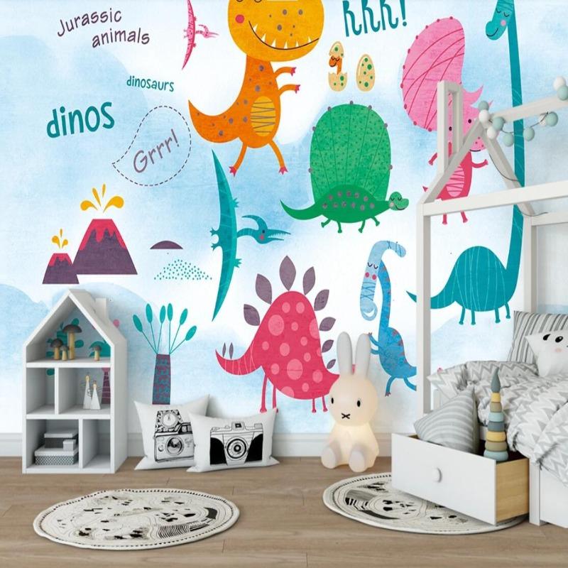Dinosaur wallpaper mural bringing prehistoric fun to a bright, modern kids bedroom with colorful cartoon dinos