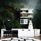 Flying pterodactyl wallpaper installation in a study area with desk and learning materials