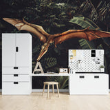 Flying dinosaur mural transforming a study space with dramatic tropical background