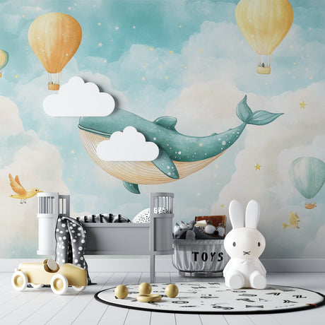 Whale and balloon nursery wallpaper in a bright modern nursery with white furniture