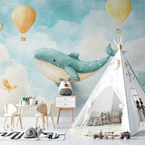 Kids bedroom featuring whale wallpaper mural with golden hot air balloons