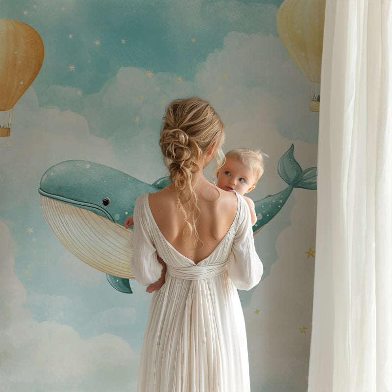 Baby room with dreamy whale wallpaper showing scale and full wall application