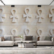 Egyptian wall mural with 3D Ankh pattern creating depth in a modern living room with neutral furniture