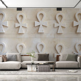 Egyptian wall mural with 3D Ankh pattern creating depth in a modern living room with neutral furniture