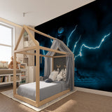 Lightning storm mural adding depth to teen bedroom with neon blue glow