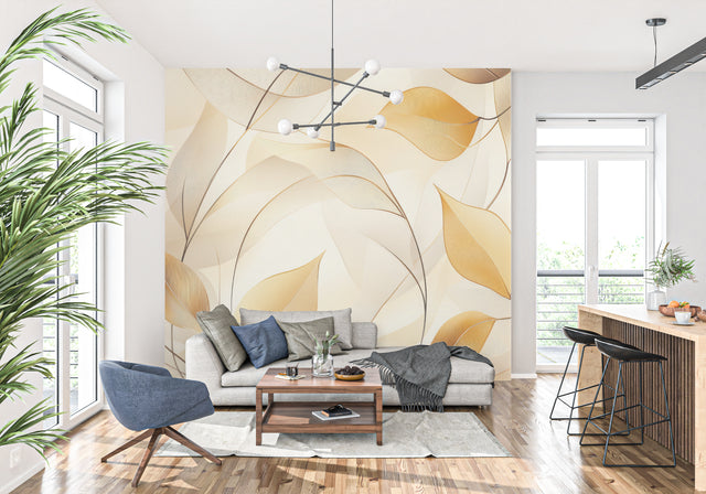 Golden leaf wallpaper creating a warm, inviting atmosphere in a modern living room with natural light