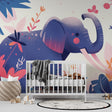 Elephant wallpaper mural in bright nursery with pink and white furniture, showing scale and tropical theme