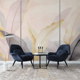 Pink and gold feather wallpaper mural creating an elegant atmosphere in a modern bedroom with soft lighting