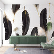 Black and gold feather wallpaper creating drama in a modern living room with high ceilings and minimal furniture