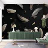 Black and gold feather wallpaper mural creating an elegant atmosphere in a modern living room with tall windows