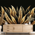 Black and gold feather wallpaper mural creating a stunning backdrop in a modern living room with contemporary furniture