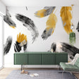Black and gold feather wallpaper mural creating an elegant statement wall in a modern living room with soft lighting
