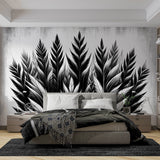 Black and white feather wallpaper mural styled in a modern living room with minimal furniture and natural light