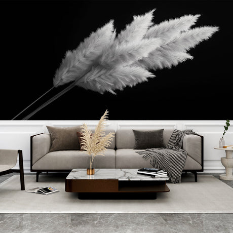 Black and white pampas grass wallpaper creating dramatic contrast in a modern living room with minimalist furniture