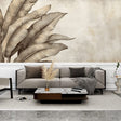 Botanical feather wall mural in soft beige creates a peaceful atmosphere in a modern living room with minimal furniture