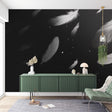 Black and white feather wallpaper mural styled in a modern bedroom with minimal furniture and natural light