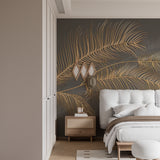 Gold palm frond wallpaper in dining room with crystal chandelier