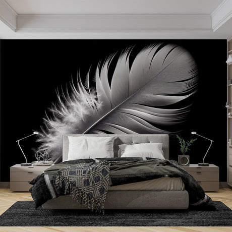 Black and white feather wallpaper creates dramatic contrast in a minimal living room setting