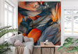 Modern Feather Wallpaper creating a bold statement wall in contemporary living room with orange sofa