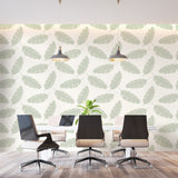 Botanical feather wall mural brightening a cozy bedroom with white furniture