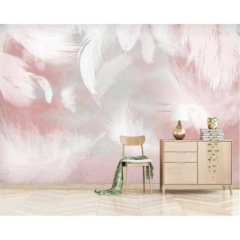 Pink feather mural creating depth in a cozy reading nook