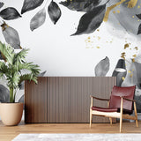 Black and gold leaf wallpaper in modern living room creating elegant atmosphere