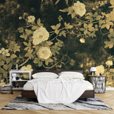 Black and gold rose wallpaper mural in modern dining room with crystal chandelier casting warm reflections on metallic details