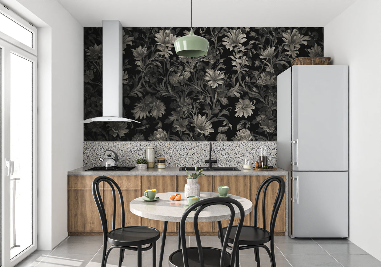 Black and grey floral wallpaper creating drama in a modern living room with grey sofa and metallic accents