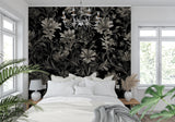 Moody hallway showcasing dramatic black floral wallpaper with modern lighting fixtures