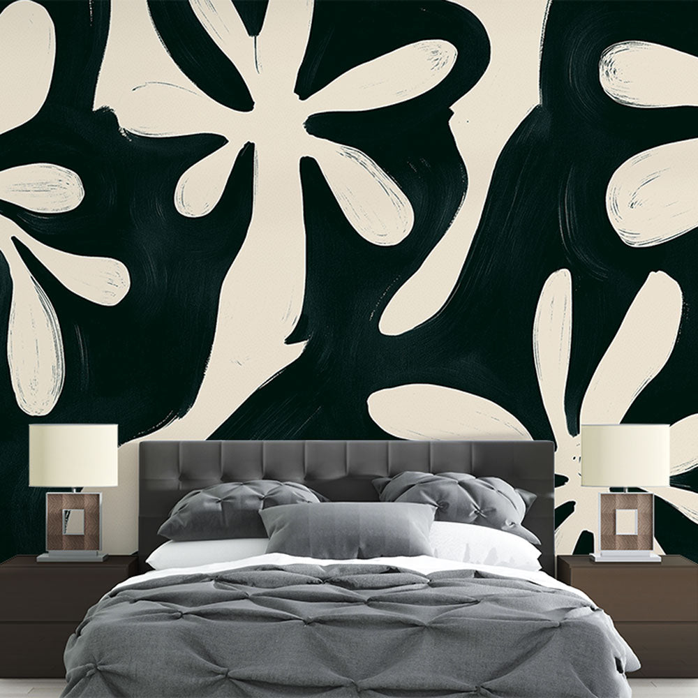 Black and white floral wallpaper mural styled in modern dining room with minimal furniture and natural light