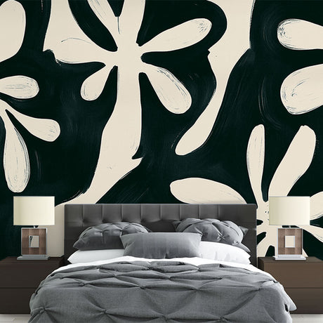 Black and white floral wallpaper mural styled in modern dining room with minimal furniture and natural light