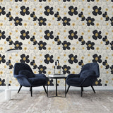 Black and gold floral wallpaper creating elegant atmosphere in modern living room with contemporary furniture