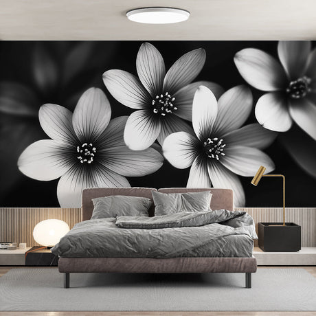 Black and white floral wallpaper creating dramatic impact in modern living room with minimalist furniture