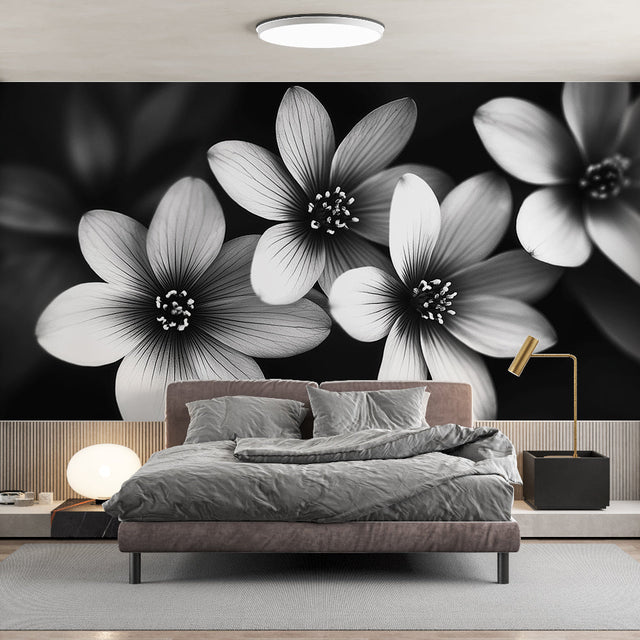 Black and white floral wallpaper creating dramatic impact in modern living room with minimalist furniture