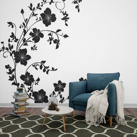 Black and white floral wallpaper creating drama in a modern living room with minimalist furniture