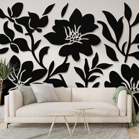 Black and white floral wallpaper mural in a modern living room creating dramatic contrast against furniture