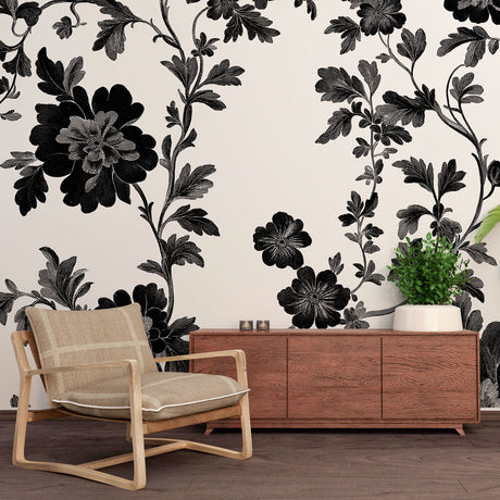 Black and white botanical wallpaper creating a stunning focal point in a modern living room with clean lines and natural light