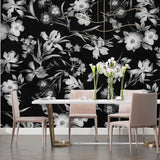 Botanical wall mural in dining room setting with elegant table and pendant lighting