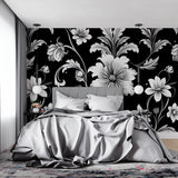 Black and white botanical wallpaper in home office setting