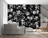Dramatic black and white botanical wallpaper in hallway with modern furniture