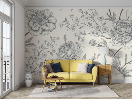 Black and white botanical sketch wallpaper in modern living room showing delicate floral pattern against light walls