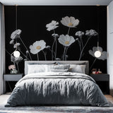 Black and white floral wallpaper with cosmos flowers adding elegance to a modern living room with clean lines