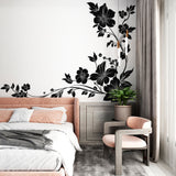 Black and white floral wallpaper creating dramatic impact in a modern living room with natural light