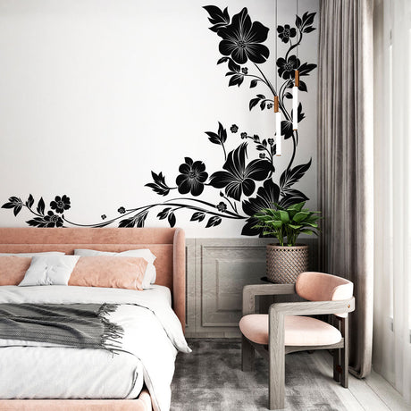 Black and white floral wallpaper creating dramatic impact in a modern living room with natural light