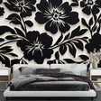 Black and white floral wallpaper creating dramatic impact in a modern living room with minimalist furniture